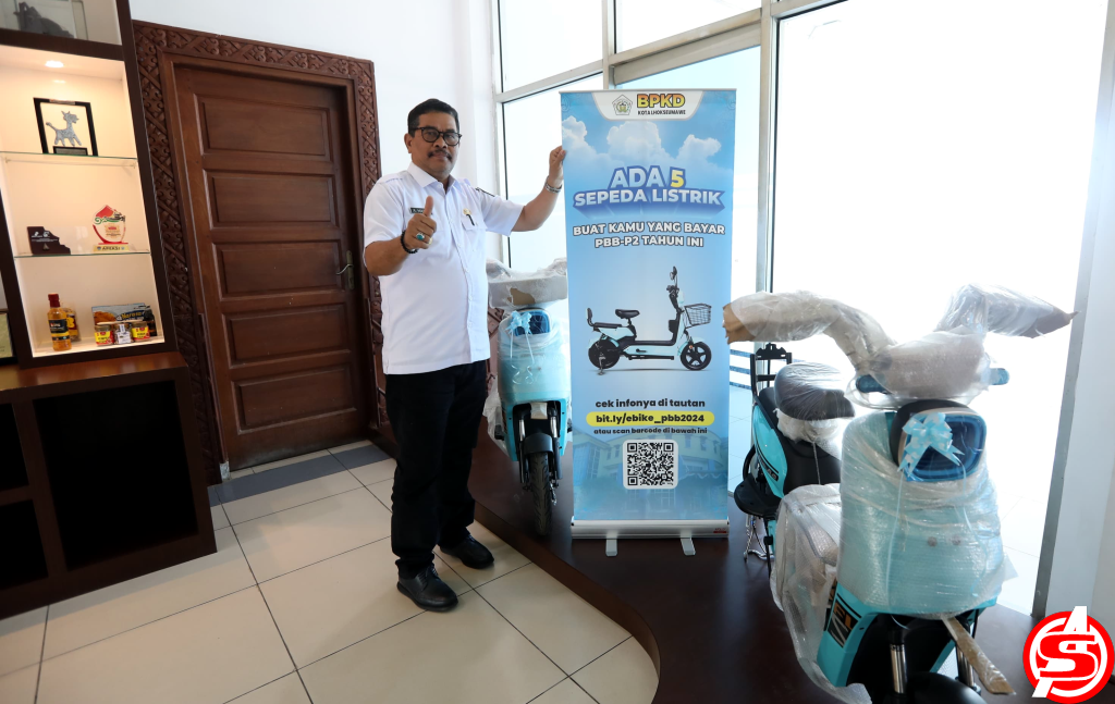 Pj. Wali Kota Lhokseumawe Bagi-Bagi Sepeda Listrik Untuk Pembayar PBB-P2